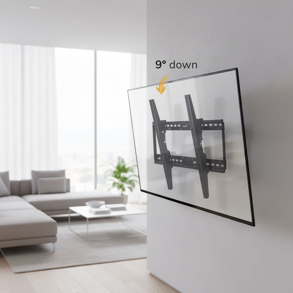 The Mount-It! Tilting TV Wall Mount secures your flat-screen close to the wall and tilts downward 9°. An arrow points to the tilt in a bright, modern living room with minimalist furniture and large windows.