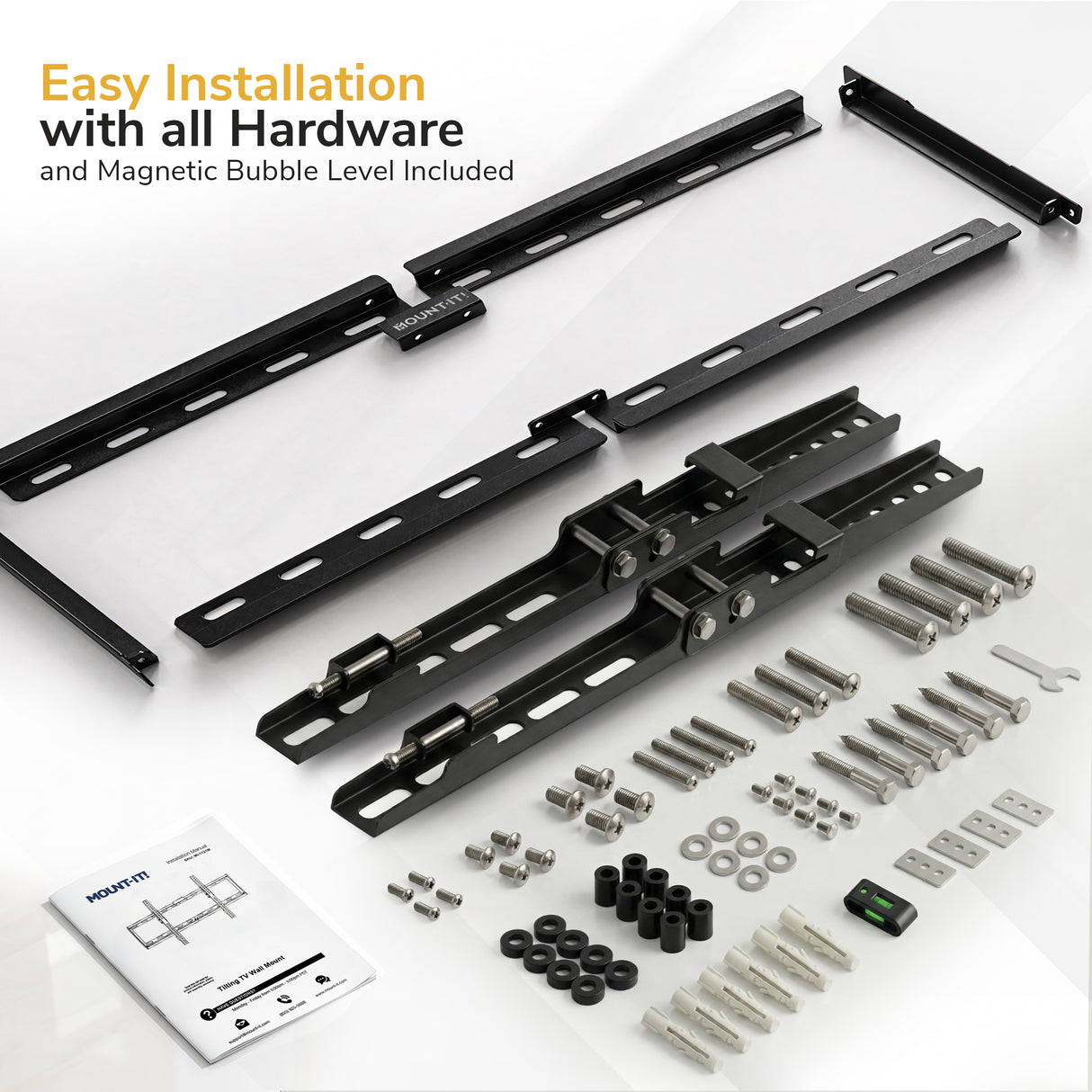 Flat lay of Mount-It! Low Profile Tilt TV Wall Mount kit with metal brackets, screws, bolts, spacers, anchors, a green magnetic bubble level, and an instruction manual—everything needed for easy installation.