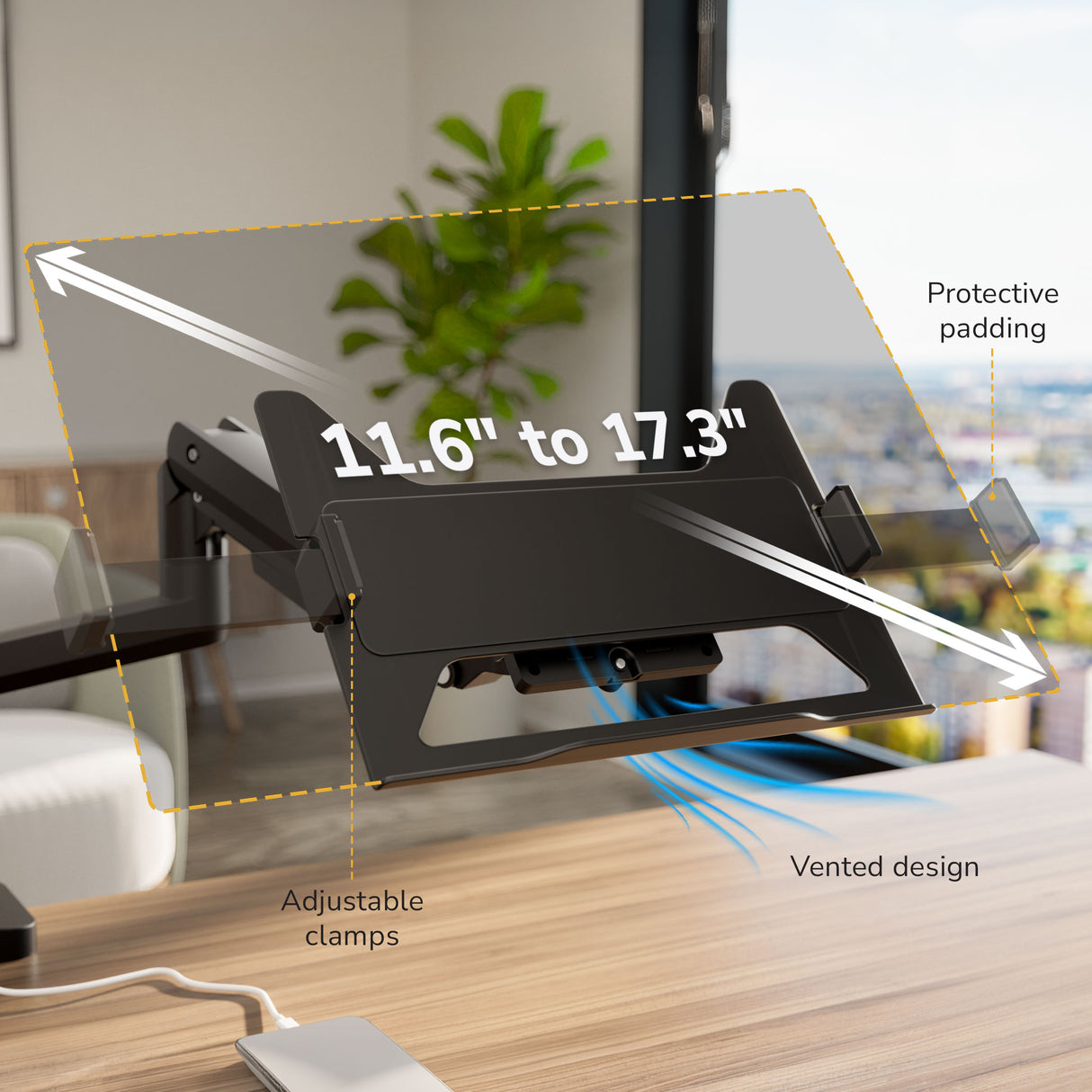 The Mount-It! Heavy-Duty Monitor and Laptop Mount with Pole and Gas Spring Arms fits 11.6–17.3" devices, featuring protective padding, adjustable clamps, and a vented design on a desk, with a plant and window in the background.