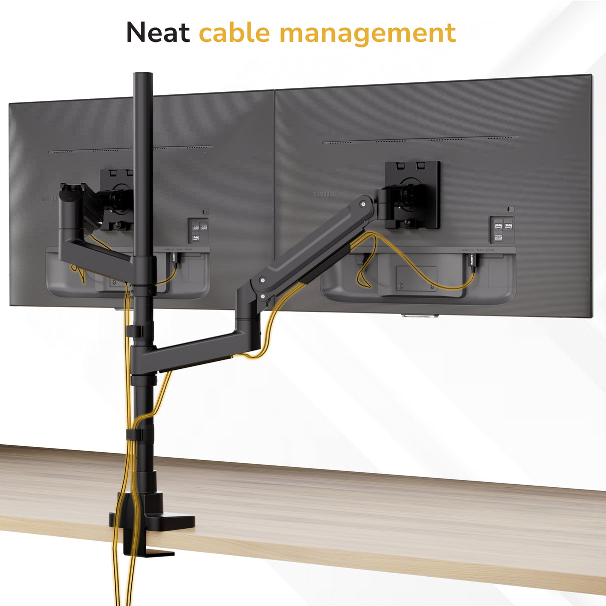 Two monitors on the Mount-It! Heavy-Duty Dual Stacking Monitor Mount above a desk, with yellow cables neatly routed along the arms for tidy cable management. Text: Neat cable management.