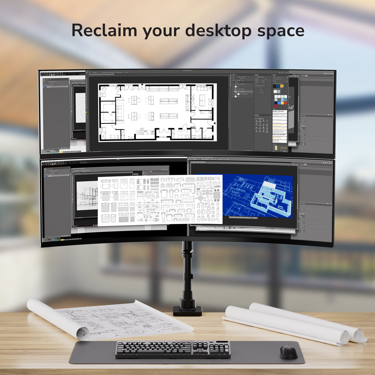 Multiple computer monitors on a stand with blurred background