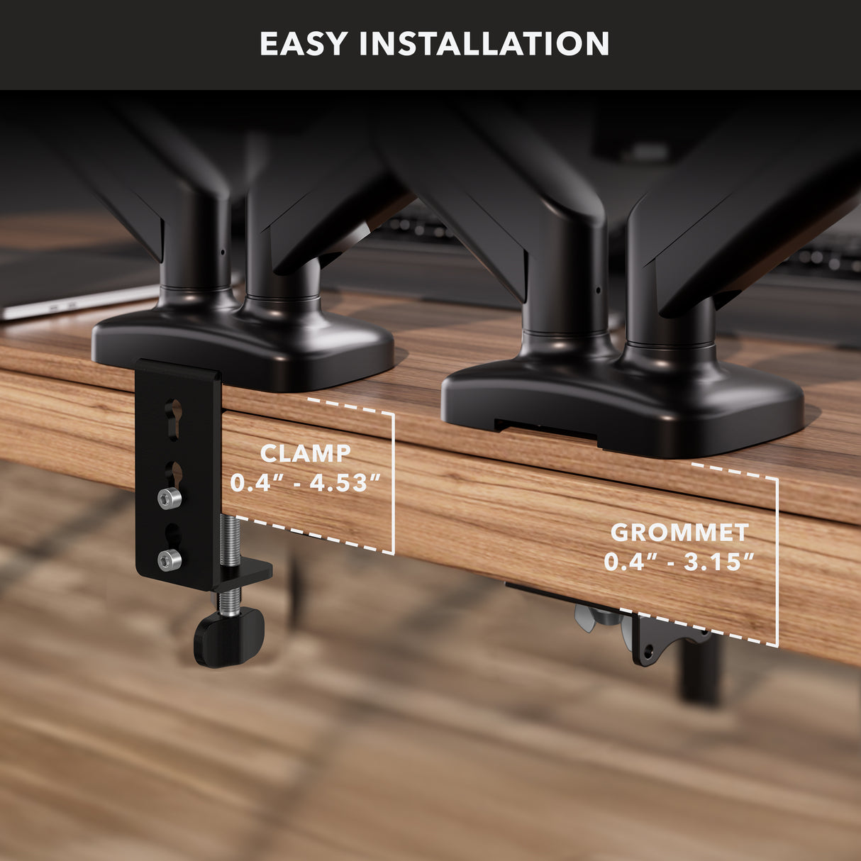 Close-up of the Mount-It! Dual Monitor Desk Mount with Gas Spring Arms on a wooden desk, showing clamp (0.4-4.53") and grommet (0.4-3.15") installation options, plus built-in cable management for a tidy workspace.