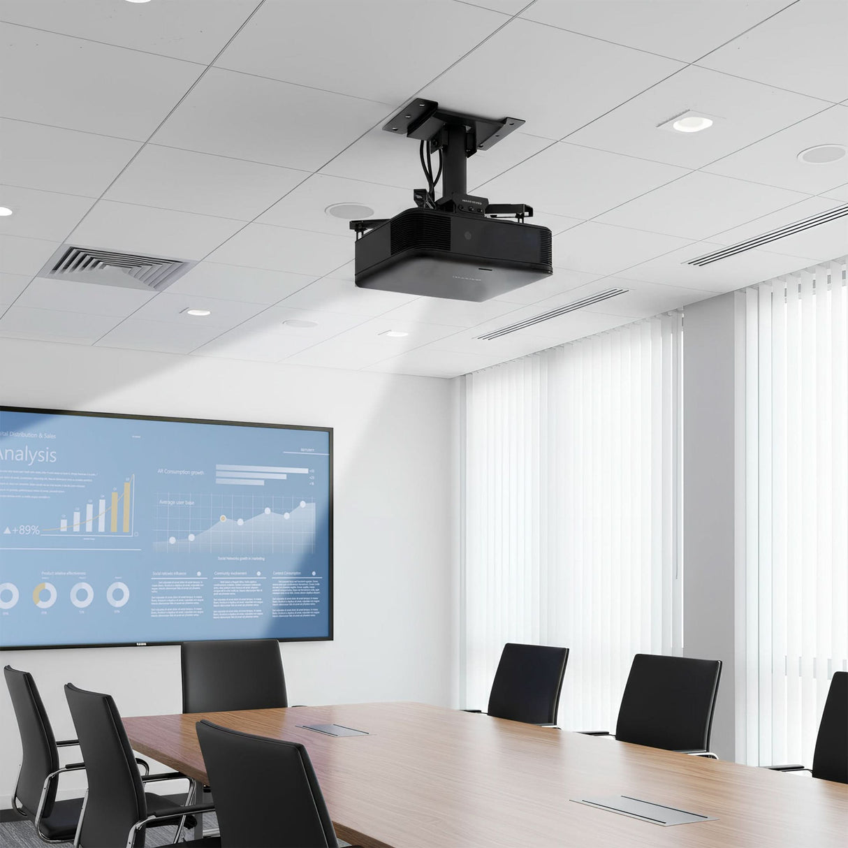 Heavy-Duty Universal Projector Ceiling Mount A modern conference room features a Mount-It! Heavy-Duty Universal Projector Ceiling Mount, a large screen with charts, a wooden table, and black chairs. Tall windows with white vertical blinds fill the space with natural light.