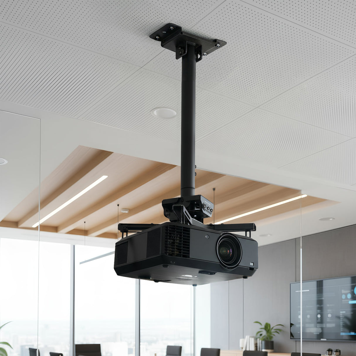 Heavy Duty Projector Ceiling Mount The Mount-It! Heavy Duty Projector Ceiling Mount in black securely holds a projector in a modern office conference room featuring glass walls, wood accents, and a large screen.