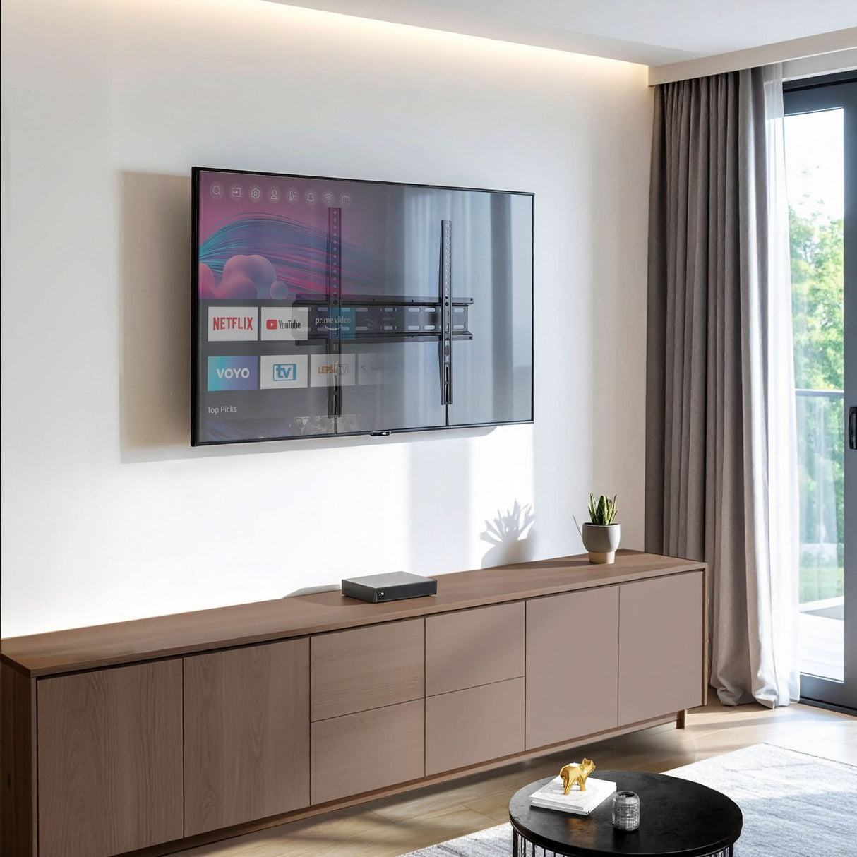 Low Profile Slim TV Wall Mount Fixed TV Bracket Modern living room with a flat-panel TV mounted close to the wall using the Mount-It! Low Profile Slim TV Wall Mount Fixed TV Bracket, showcasing its sleek design that holds the TV just 1.1 inches from the wall for a clean, space-saving appearance, compatible with 32 to 55-inch TVs and providing sturdy, durable support with a minimalist look.