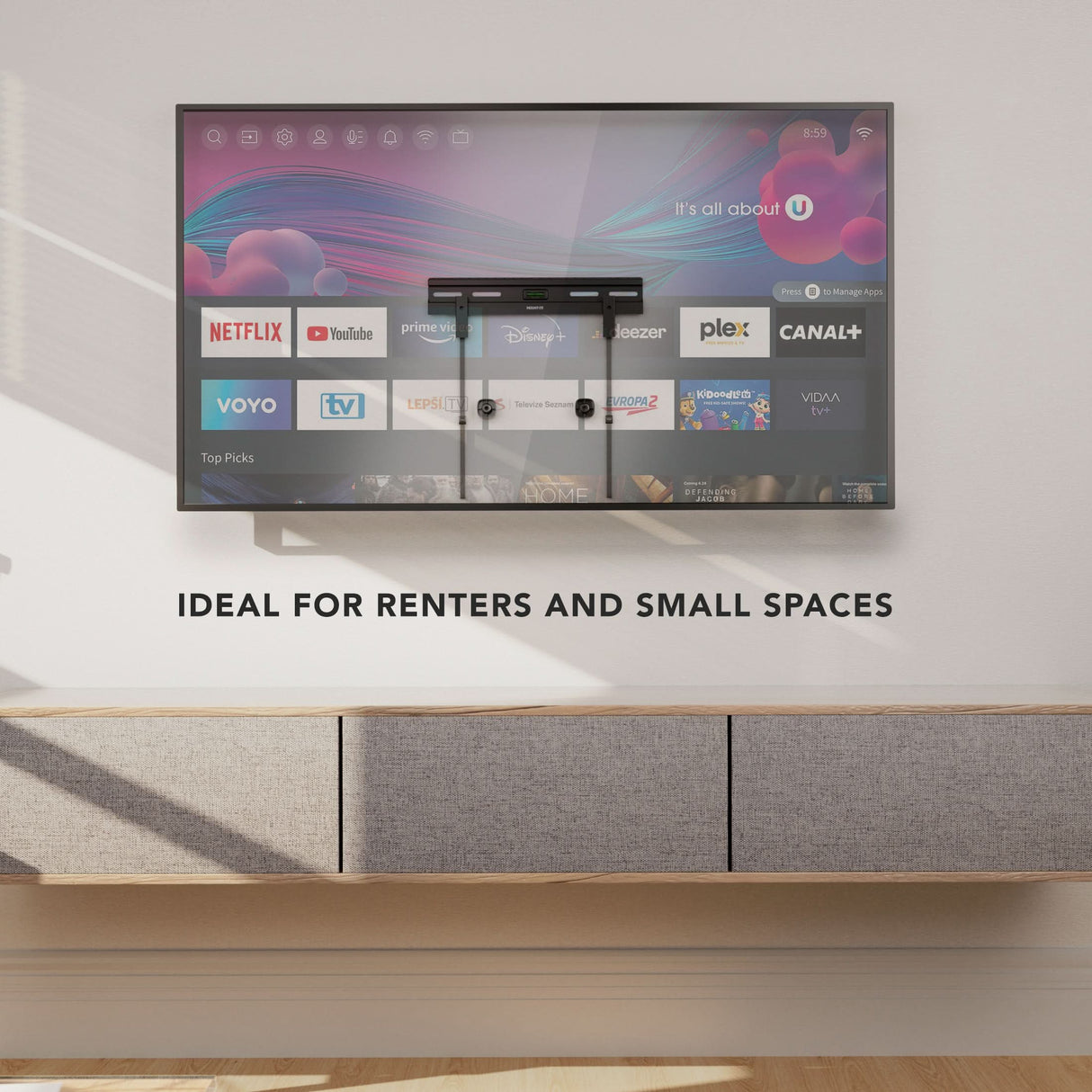 No Stud TV Wall Mount for TVs 23" - 65" No Stud TV Wall Mount for TVs 23" - 65" installed on a clean wall above a modern floating cabinet in a minimalist room, demonstrating a low-profile, flexible, damage-free mounting solution ideal for renters and small spaces, supporting a large flat-screen TV with streaming apps visible on the screen, emphasizing simplicity and strength without drilling or stud access.