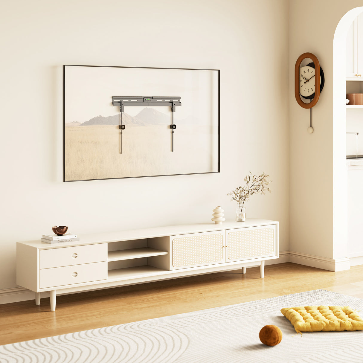 No Stud TV Wall Mount for TVs 37" to 85" No Stud TV Wall Mount for TVs 37" to 86" installed on smooth drywall above a modern white media console in a stylish living room, demonstrating a sleek flush design without studs or wood drilling, highlighting the mount’s secure, low-profile fit and integrated bubble level, ideal for large TVs in contemporary home settings where traditional stud mounting is not possible or desired.