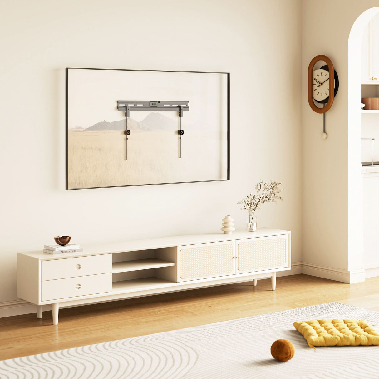 No Stud TV Wall Mount for TVs 37" to 85" No Stud TV Wall Mount for TVs 37" to 86" installed on smooth drywall above a modern white media console in a stylish living room, demonstrating a sleek flush design without studs or wood drilling, highlighting the mount’s secure, low-profile fit and integrated bubble level, ideal for large TVs in contemporary home settings where traditional stud mounting is not possible or desired.