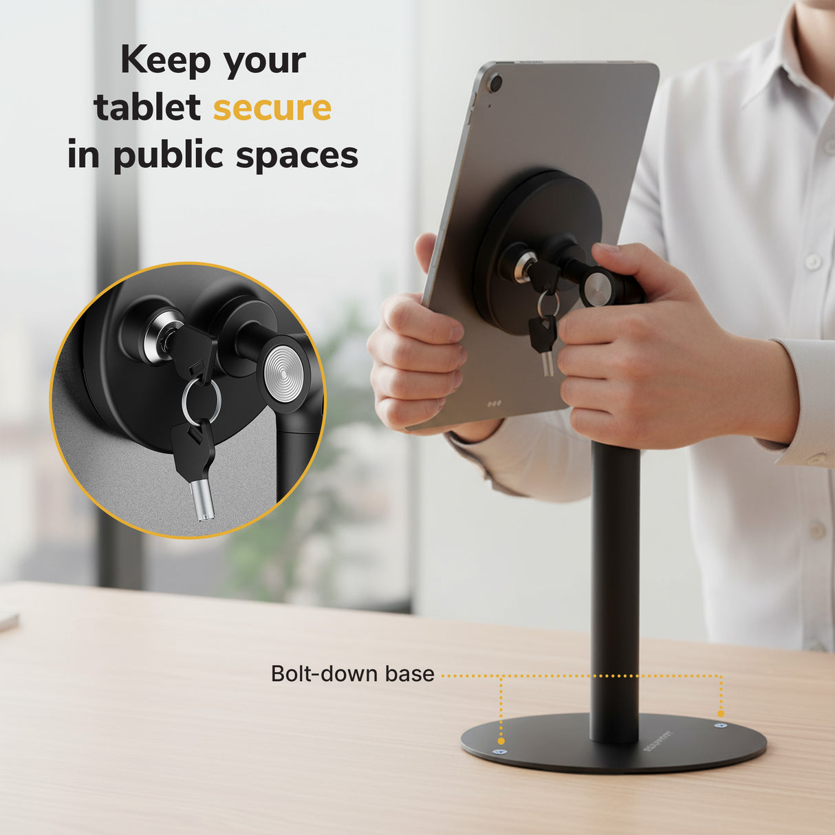 Universal Anti-Theft Tablet Countertop Stand Secure your tablet with the Mount-It! Universal Anti-Theft Tablet Countertop Stand, featuring a lock and key. Text: Keep your tablet secure in public spaces. A label highlights the stand’s sturdy, bolt-down base.