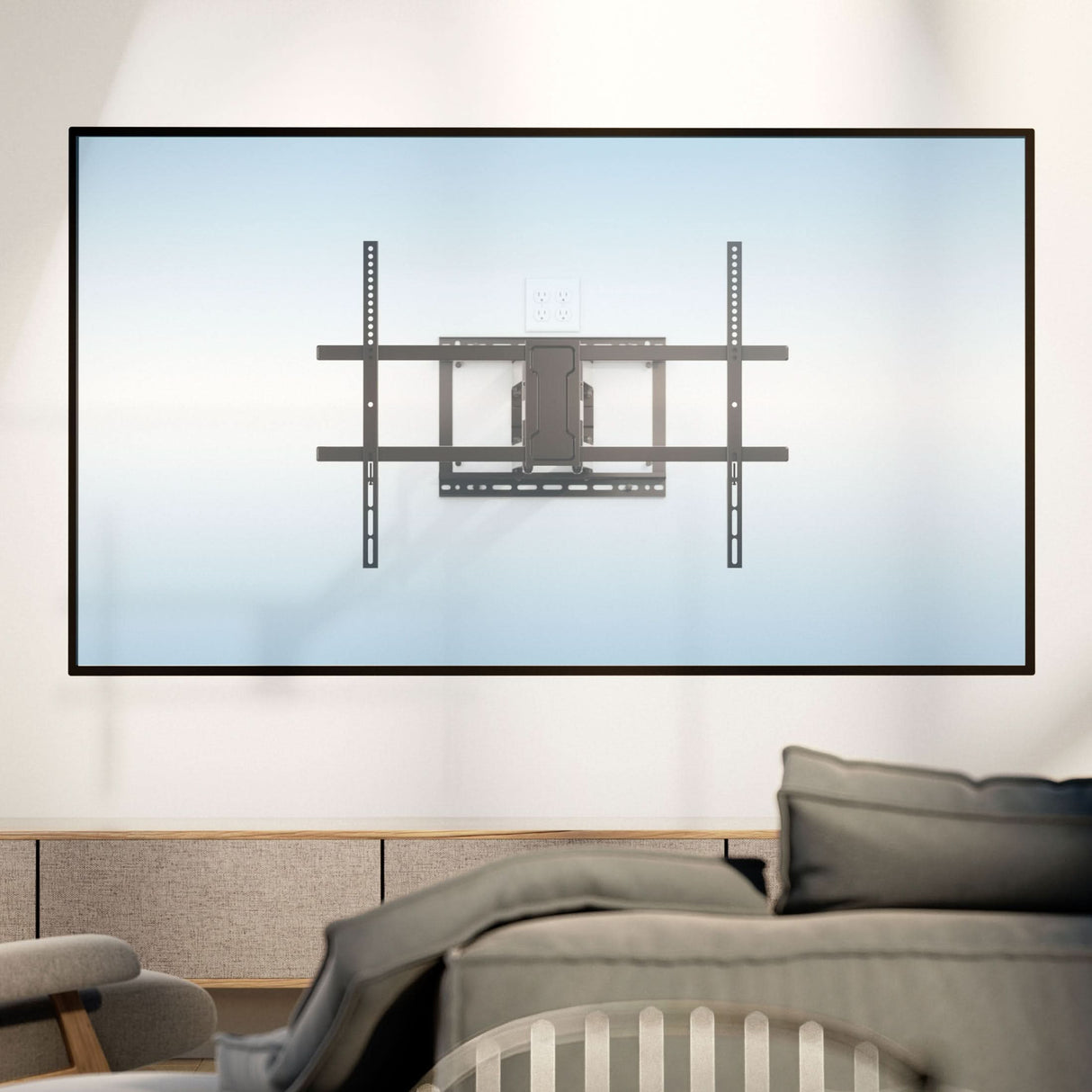 Full Motion TV Wall Mount with Extra Long Extension for 43" - 100" TVs Full Motion TV Wall Mount with Extra Long Extension for 43" - 100" TVs installed on a light-colored wall behind a modern living room setup, showcasing its heavy-duty steel construction and adjustable arms designed for swivel, tilt, and up to 42.5" extension, supporting medium to extra-large TVs with a sleek, space-saving retractable design.