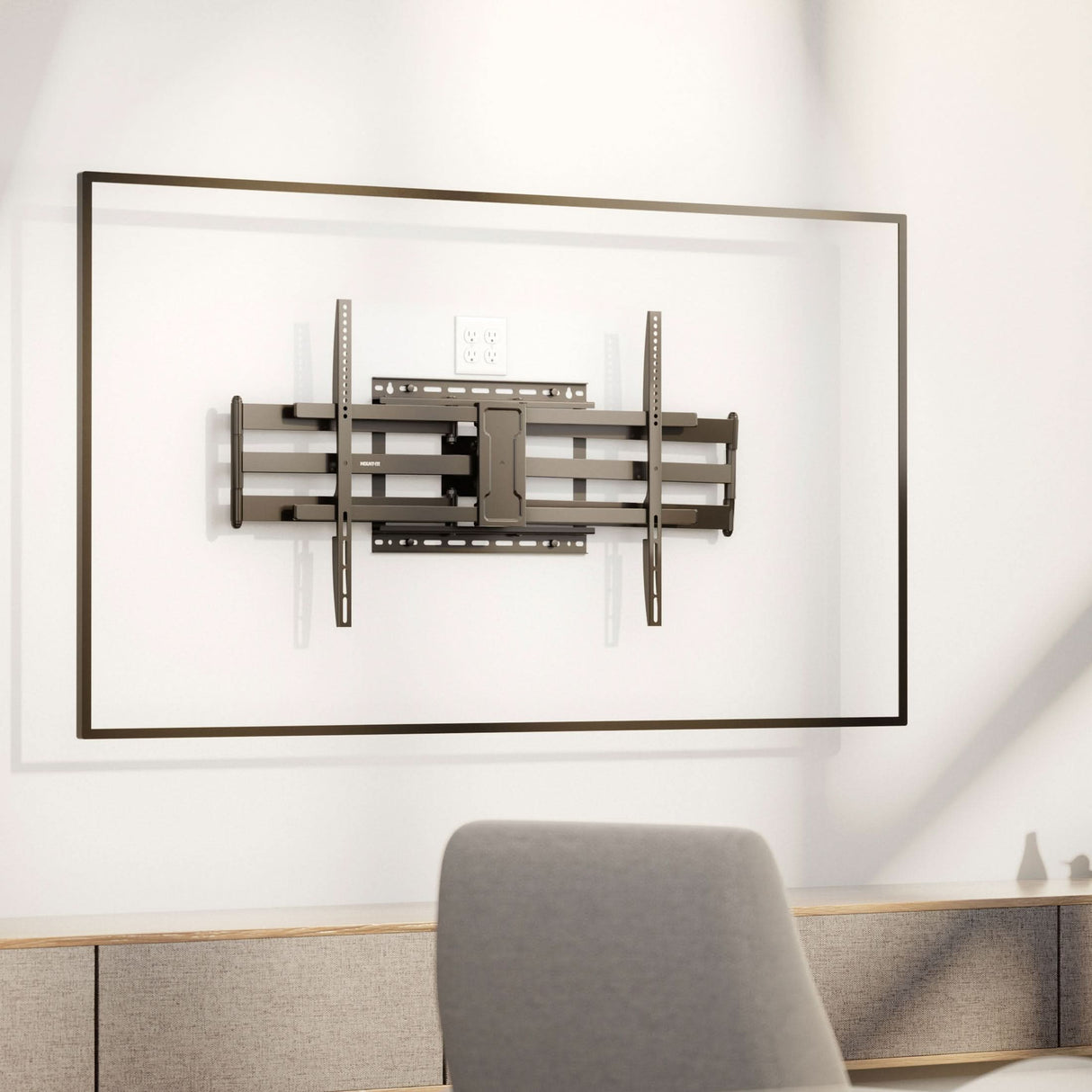 Full Motion TV Wall Mount with Extra Long Extension for 43" - 100" TVs Full Motion TV Wall Mount with Extra Long Extension for 43" - 100" TVs installed on a wall in a modern living space, featuring heavy-duty steel dual arms designed for secure support, adjustable swivel and tilt for optimal viewing angles, and a sleek retractable design that keeps the TV close to the wall for a clean, stylish look above a low cabinet.