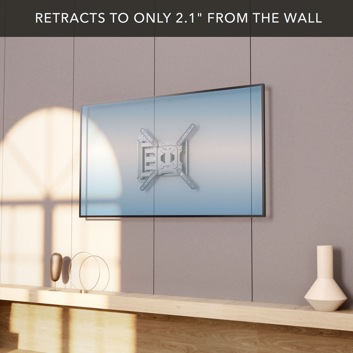 Full Motion TV Wall Mount with Extra Long Extension for 23"-65" TVs Full Motion TV Wall Mount with Extra Long Extension for 23 to 65 inch TVs shown retracted to 2.1 inches from the wall, mounted on a neutral gray panel above a wooden shelf with decorative items, demonstrating sleek low-profile design and secure steel construction for space-saving setup.