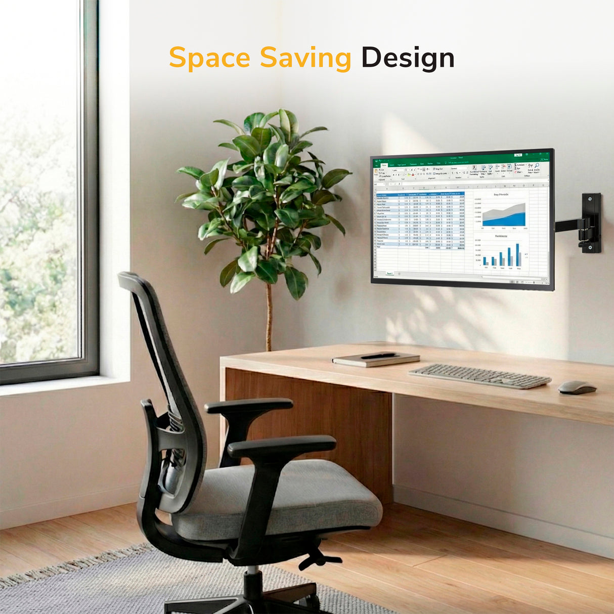 Full Motion Display Wall Mount A modern home office features a wooden desk, ergonomic chair, large window, and the Mount-It! Full Motion Display Wall Mount holding a monitor with a spreadsheet. Wireless keyboard, mouse, and potted plant included. Text: "Space Saving Design.