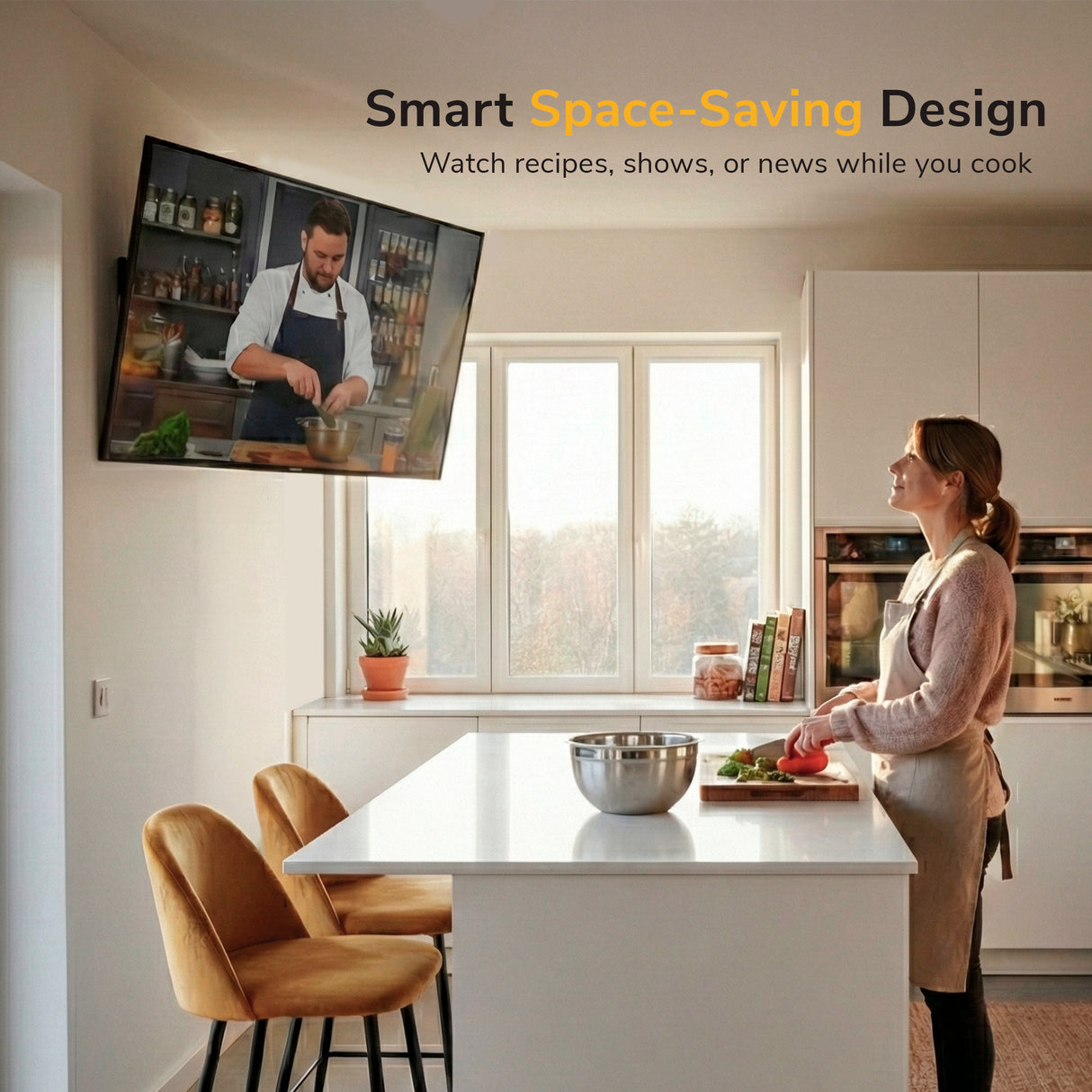 Full Motion TV Wall Mount A woman cooks in a modern kitchen, watching a show on her TV mounted with the Mount-It! Full Motion TV Wall Mount. Text reads: Smart Space-Saving Design—enjoy recipes, shows, or news while you cook.