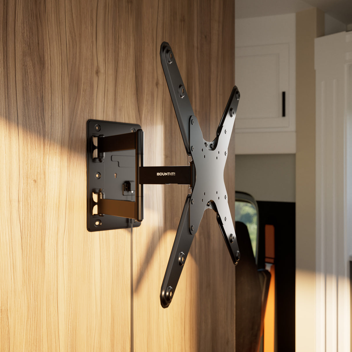 The Mount-It! Locking RV and Trailer TV Wall Mount with Detachable Bracket is installed on a light wood-paneled wall in a modern home, ready to securely support a flat-screen TV.