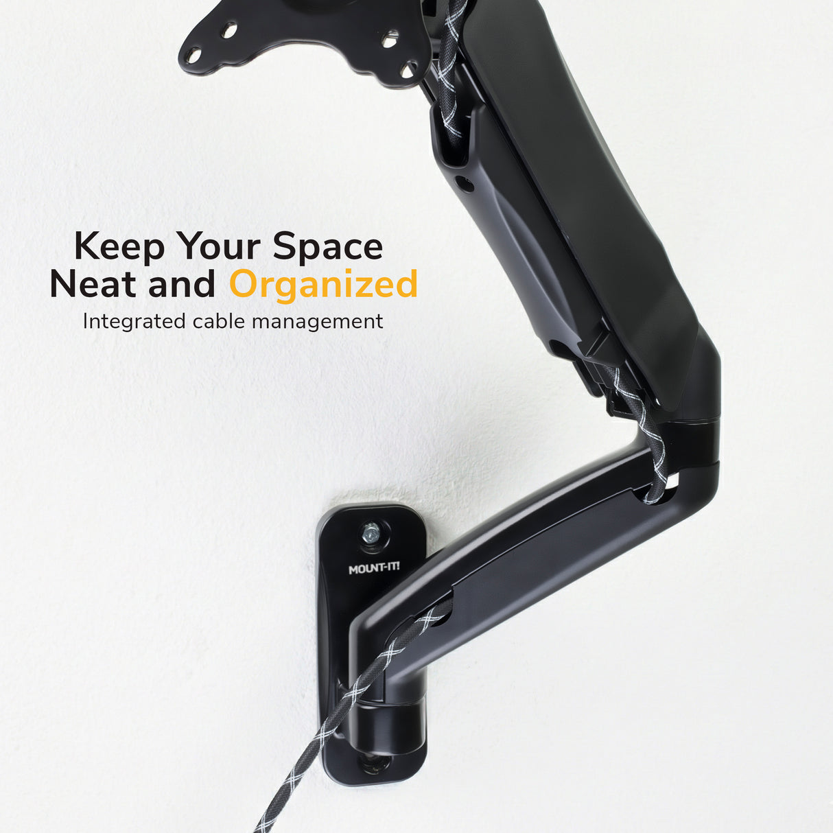 A Mount-It! Single Monitor Wall Mount Arm in black, featuring integrated cable management and VESA compatibility, is mounted on a white wall. Text on the image: Keep Your Space Neat and Organized. Integrated cable management.