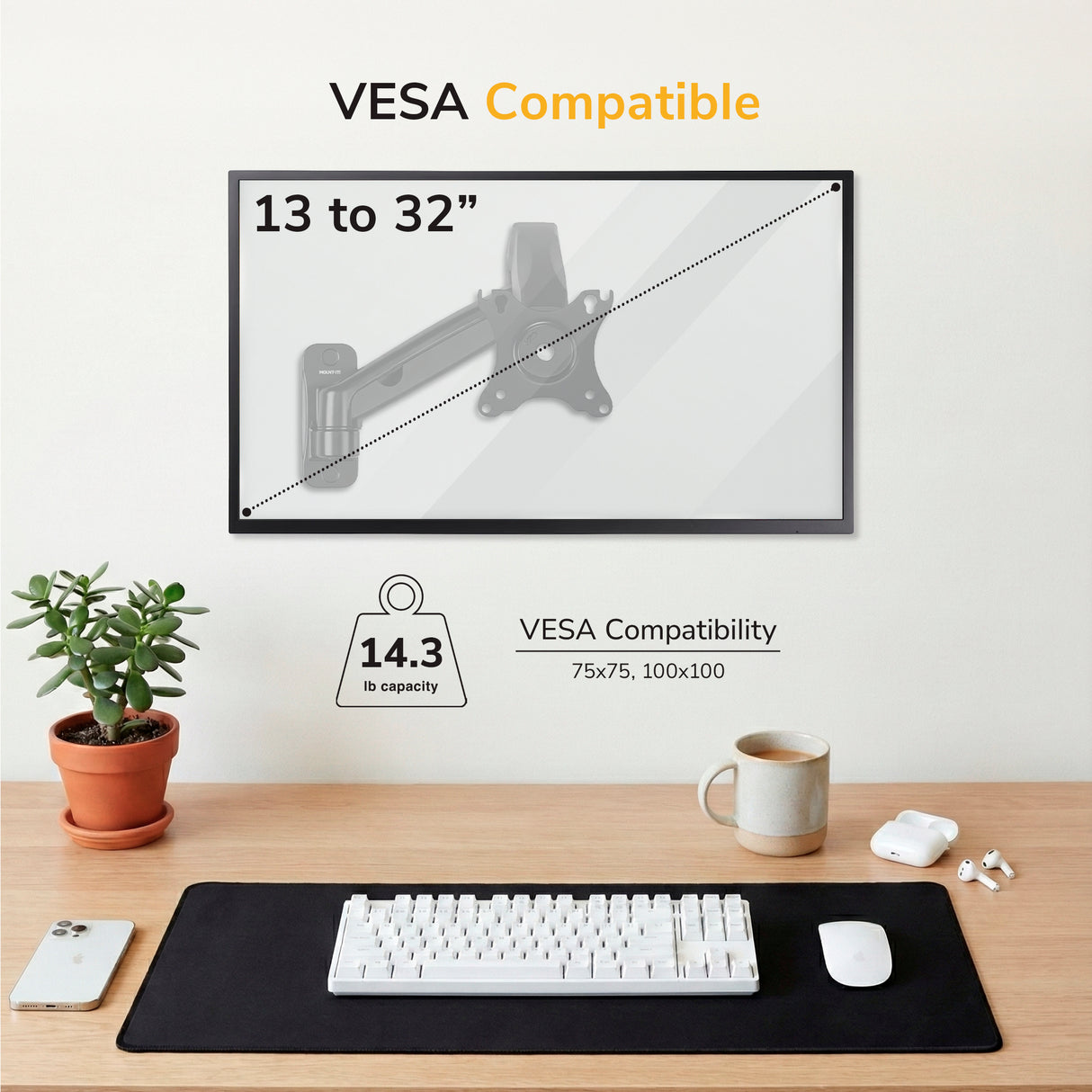 A Mount-It! Single Monitor Wall Mount Arm holds screens 13-32” (75x75/100x100), up to 14.3 lbs, above a desk with a plant, keyboard, mouse, mug, pen, and black mat.