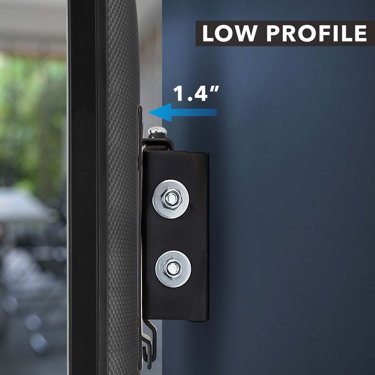 Tilting TV Wall Mount Close-up of the Mount-It! Tilting TV Wall Mount for 32-inch TVs, highlighting its low profile with just a 1.4-inch gap from the wall. A blurred room interior appears in the background.