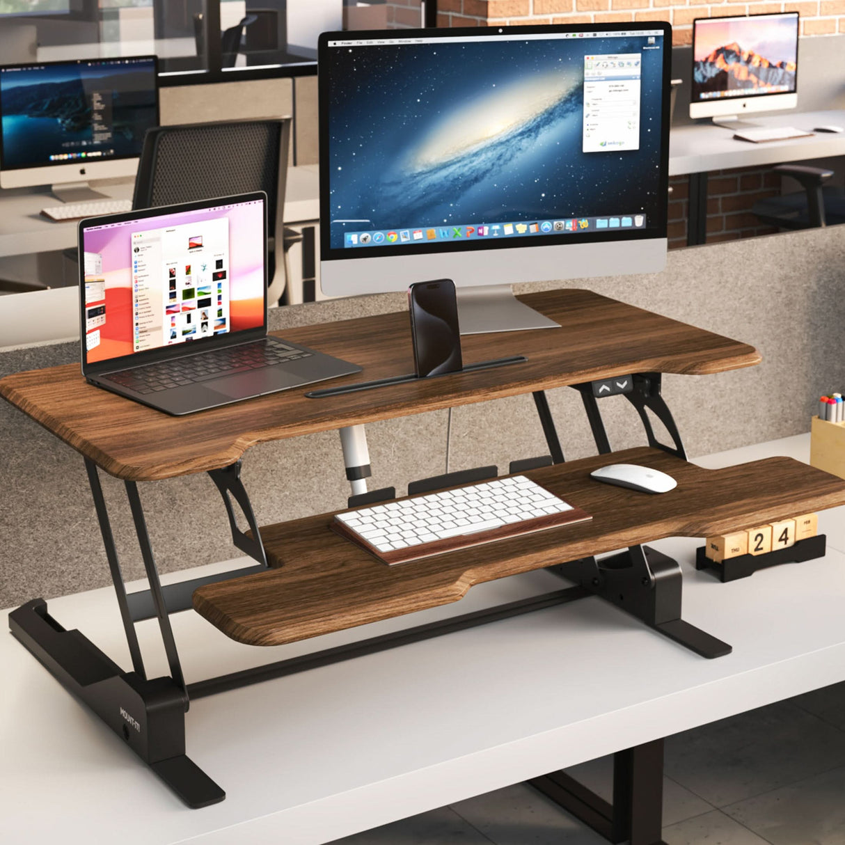 Electric Standing Desk Converter with 38" Desktop Electric Standing Desk Converter with 38" Desktop - MI-8011 - Dark Walnut Woodgrain - In use with monitor and laptop in an office environment