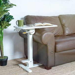 Mobile Standing Desk - Foldable Rolling Overbed Table - MI-8046 - next to a couch with book and coffee cup Mobile Standing Desk - Foldable Rolling Overbed Table - MI-8046 - next to a couch with book and coffee cup