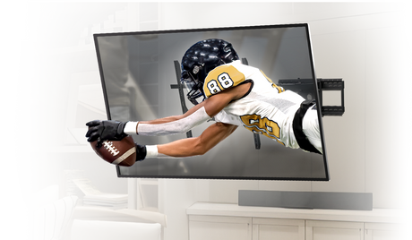 TV mounted on a wall showing a football player catching the football on a TV mounted on a full motion tv mount on a wall