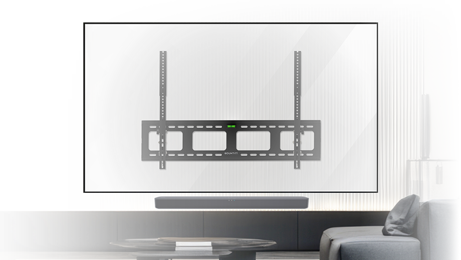 A wall-mounted flat-screen TV with a black TV mounting bracket visible, above a soundbar and a round coffee table in a modern living room.