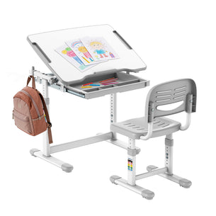 The Mount-It! Kids Desk and Chair Set for ages 3-10 features height adjustment, a tilting desktop, cartoon drawing, colored pencils in a pull-out tray, and space to hang a pink backpack on the side.