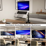 A modern office setup showcases a laptop on the Mount-It! Laptop Mount with Pole and Gas Spring Arm above a desk, alongside three monitors displaying abstract blue and orange swirls, captioned: Consistent Aesthetics, Built for Businesses.