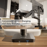 The Mount-It! Heavy-Duty Monitor and Laptop Mount with Pole and Gas Spring Arms sits on a desk, displaying close-up USB-C and USB-A ports at its base. Text: Enjoy easy device charging and data transfer with this ergonomic monitor laptop mount.