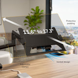 The Mount-It! Heavy-Duty Monitor and Laptop Mount with Pole and Gas Spring Arms fits 11.6–17.3" devices, featuring protective padding, adjustable clamps, and a vented design on a desk, with a plant and window in the background.