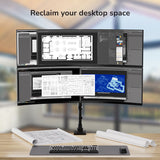 Multiple computer monitors on a stand with blurred background