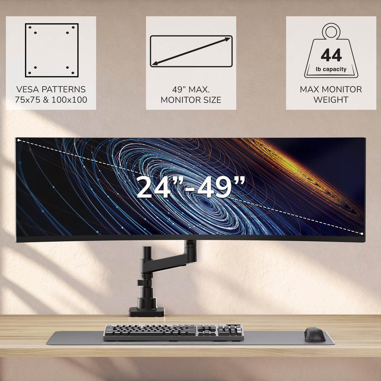 The Mount-It! Heavy-Duty Monitor Mount with Gas Spring Arm holds 24-49” screens up to 44 lbs, supports VESA 75x75 & 100x100, and features a top-mounted clamp for ultrawide monitors above your desk, paired with a keyboard and mouse.