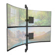 Two large curved monitors are stacked vertically and mounted using the Mount-It! Heavy-Duty Dual Stacked Monitor Wall Mount, displaying scenic landscapes—a forest with a river above and mountains with a lake below.