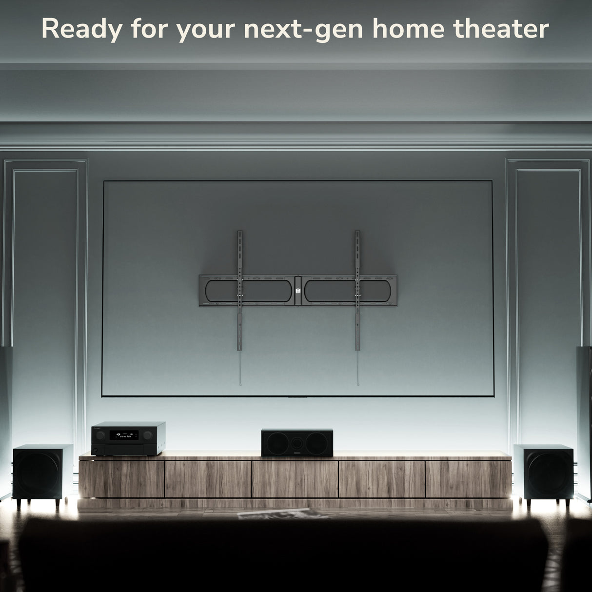 Modern home theater setup with a large screen and audio equipment.