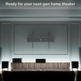 Modern home theater setup with a large screen and audio equipment.