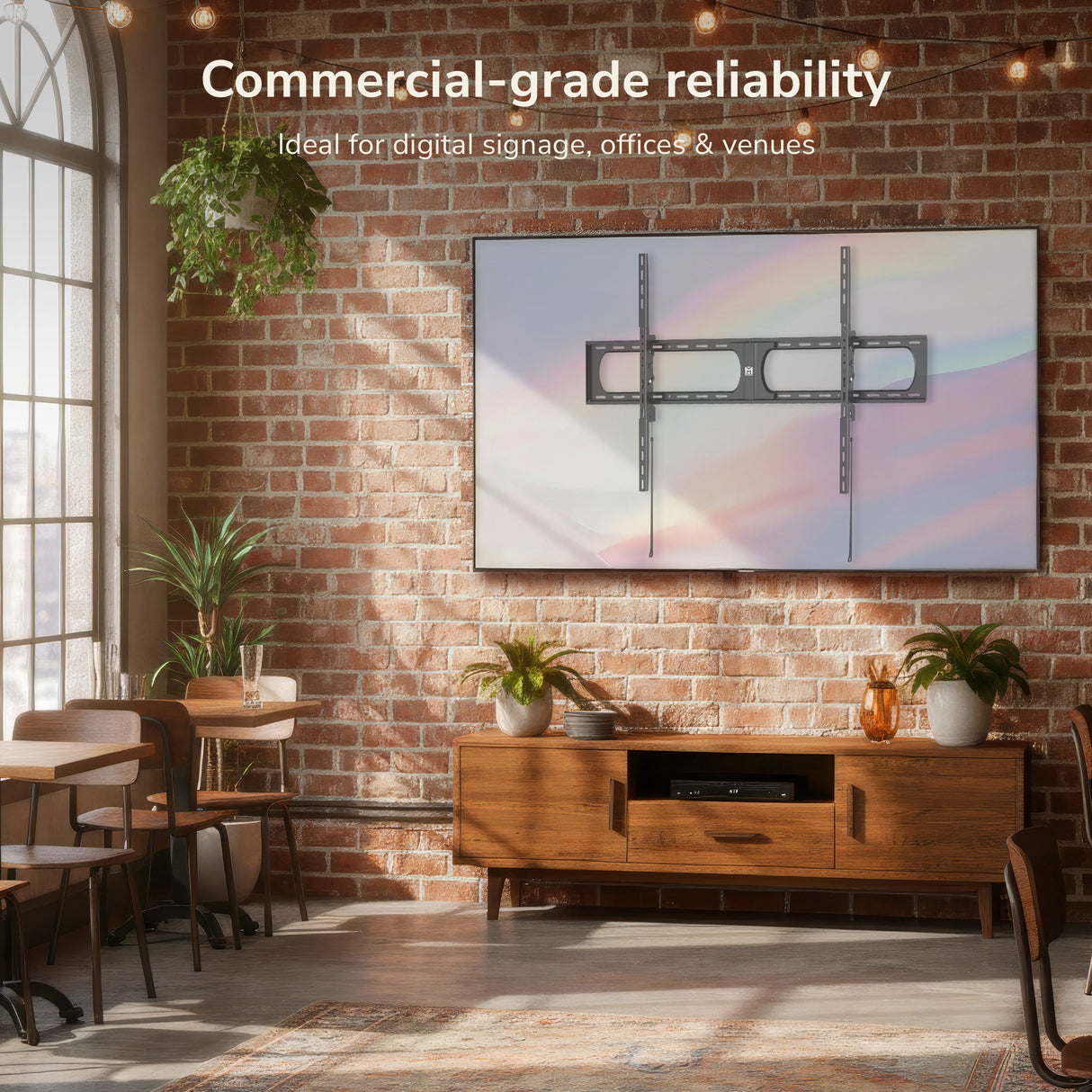 Modern interior with a mounted TV on a brick wall, ideal for digital signage.