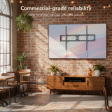 Modern interior with a mounted TV on a brick wall, ideal for digital signage.