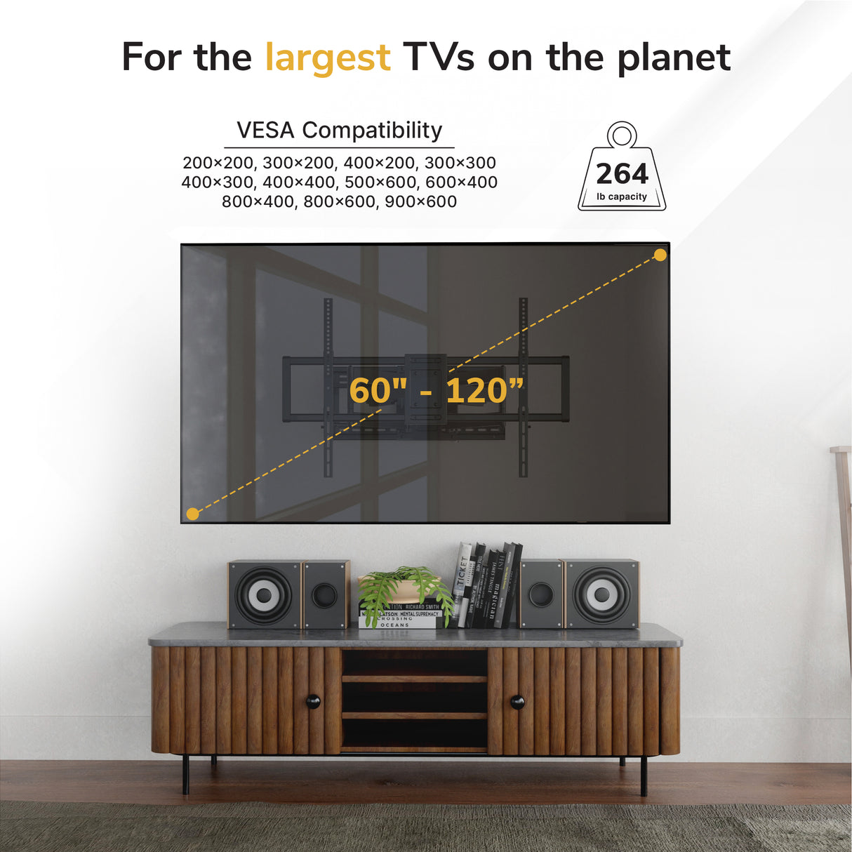 A TV wall mount shown mounted above a media console in a real room setting, with text overlays indicating VESA compatibility and weight capacity. Because a real interior environment is visible, this fits Lifestyle rather than Product/Packaging.