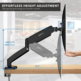 A Mount-It! Single Monitor Desk Mount with Gas Spring Arm is attached to a desk. The arm extends up to 19.4 inches and adjusts monitor height from 5.9 to 16.5 inches, allowing for effortless and comfortable viewing adjustments.