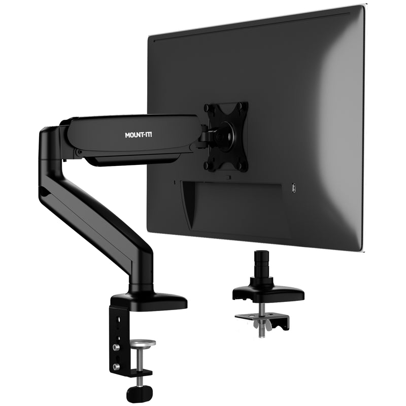 The Mount-It! Single Monitor Desk Mount with Gas Spring Arm is securely clamped to the desk, supporting a flat-screen. A second clamp mount is also shown, demonstrating simple installation and built-in cable management for a tidy workspace.