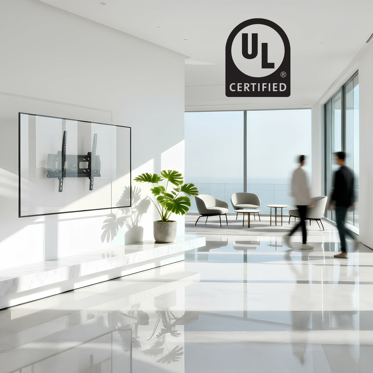 A modern, bright office lobby with floor-to-ceiling windows, sleek furniture, two blurred figures walking past a Mount-It! Locking Anti-Theft TV Wall Mount under a UL Certified logo, supporting VESA 400x400.