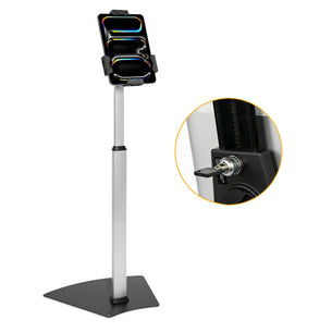 The Mount-It! Secure Universal Tablet Floor Stand with Lock is displayed with a mounted tablet. An inset shows a close-up of a key in the lock, highlighting its security—perfect for retail kiosk use.