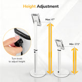 Two white Mount-It! Universal Tablet Floor Kiosks are shown, one at max height (47") and one at min height (27.5"). An inset shows a hand turning the knob labeled "Turn knob to adjust height." Text: Height Adjustment for secure tablet mount.