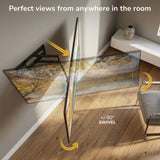 The Mount-It! Full-Motion TV Wall Mount with 40" Extension features sturdy dual arms that swivel left and right for wide-range viewing. Perfect views from anywhere in the room, shown in a modern space with natural light and a vase.