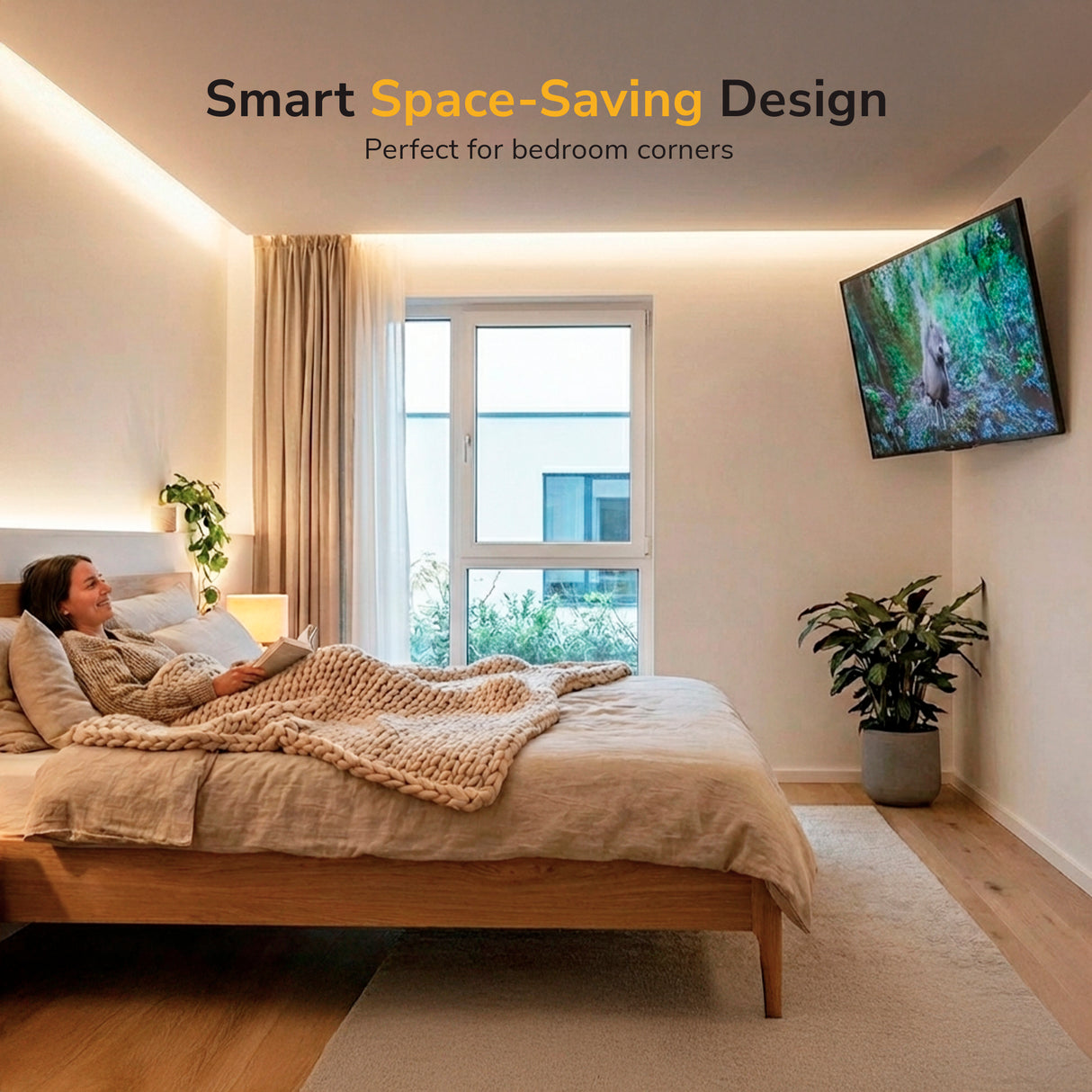 A woman relaxes on a modern bed in a cozy beige room, watching TV secured with the Mount-It! Anti-Theft Full Motion TV Wall Mount. The space features large windows, a plant, soft lighting, and the phrase “Smart Space-Saving Design.”.
