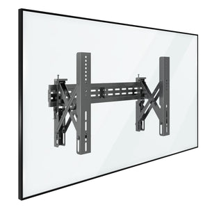 A flat-screen TV is mounted on the Mount-It! Pop-Out Video Wall Mount, shown from an angle that highlights the sturdy metal support structure behind the screen.