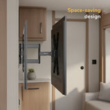 A Mount-It! Locking RV and Trailer TV Wall Mount with Detachable Bracket holds a flat-screen TV sideways in a modern, compact room with wooden cabinets, highlighting its space-saving design. Image text: Space-saving design.