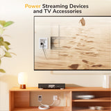 A living room features a TV mounted on the wall with a streaming device below. The Mount-It! In-Wall Cable Management Kit with Power Input Module neatly hides power outlets and cables, creating a clean look for your TV and accessories.