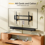 A wall-mounted TV sits above a wooden console and soundbar. The Mount-It! In-Wall Cable Management Kit with USB and Power Input Module neatly hides cables behind the wall, exiting at a recessed power outlet near the console.