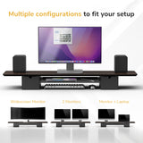A Mount-It! Extra Wide Monitor Riser with Drawers and Shelf holds a widescreen monitor, speakers, and keyboard. Text reads, "Multiple configurations to fit your setup," with images of various monitor arrangements below.